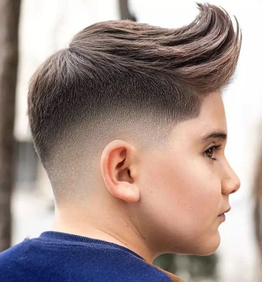 Kid with a fresh skin fade at Uppercuts