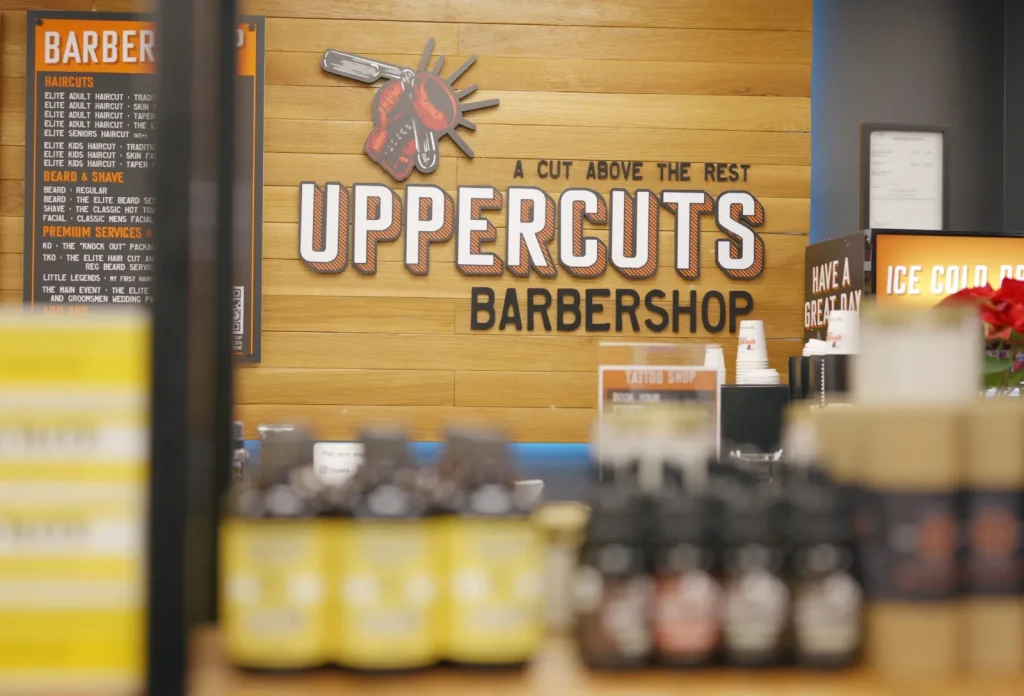 Uppercuts Barbershop sign and product wall
