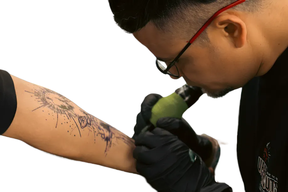 Tattoo artist at work in the Uppercuts Tattoo Shop, Maple Ridge